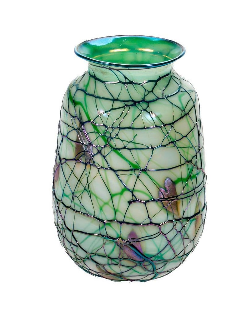 Green and Purple Art Glass Vase.: The pearlescent green glass vase with applied splatter decoration of green and iridescent purple; 7 1/2" H. Unsigned. Good condition.