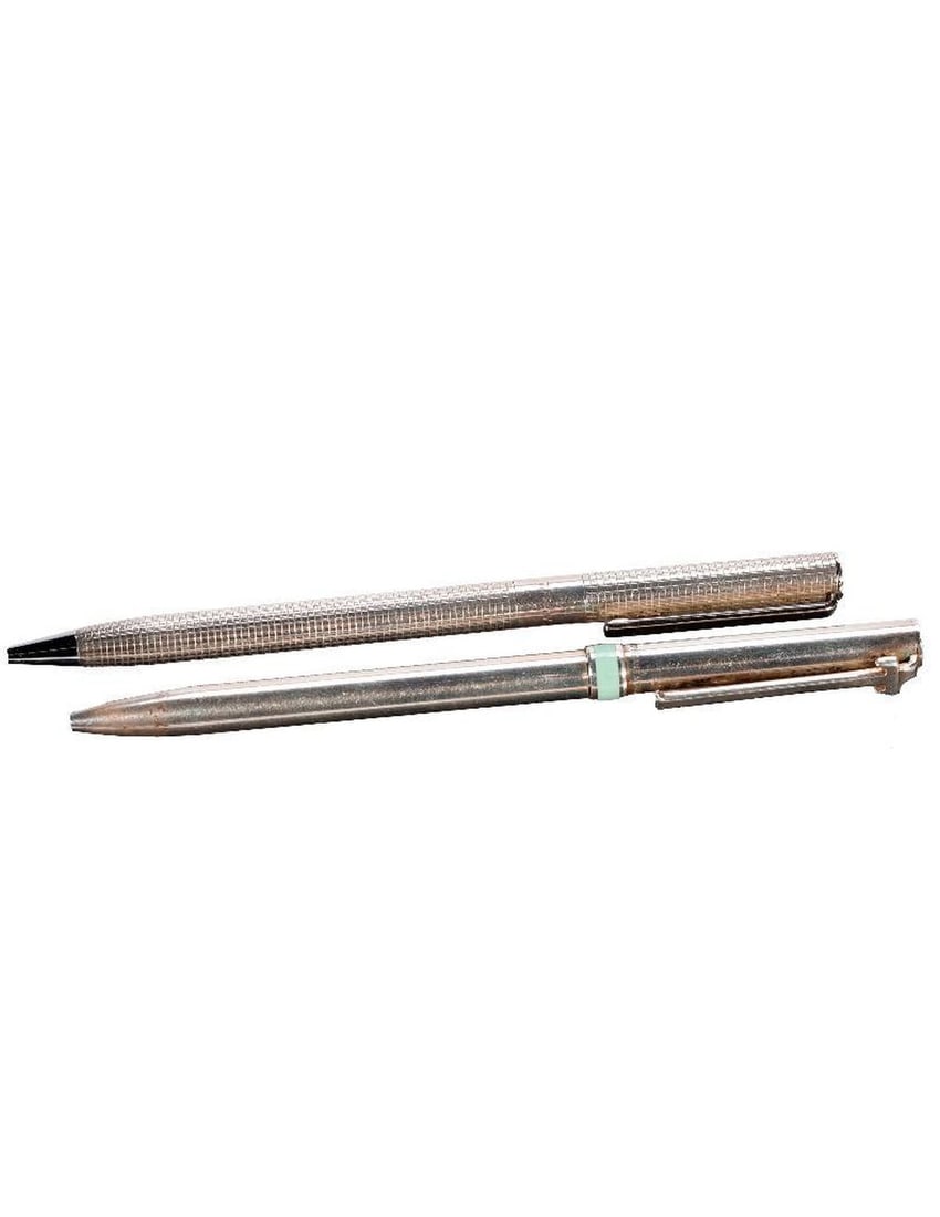Two Tiffany & Co. Ballpoint Pens.: Two Tiffany & Co. 925 sterling ballpoint pens: one with pale blue/green band; the other etched grid design (both in used condition; one not extending/may need new spring). FROM THE FAMILY OF CAPTAIN C