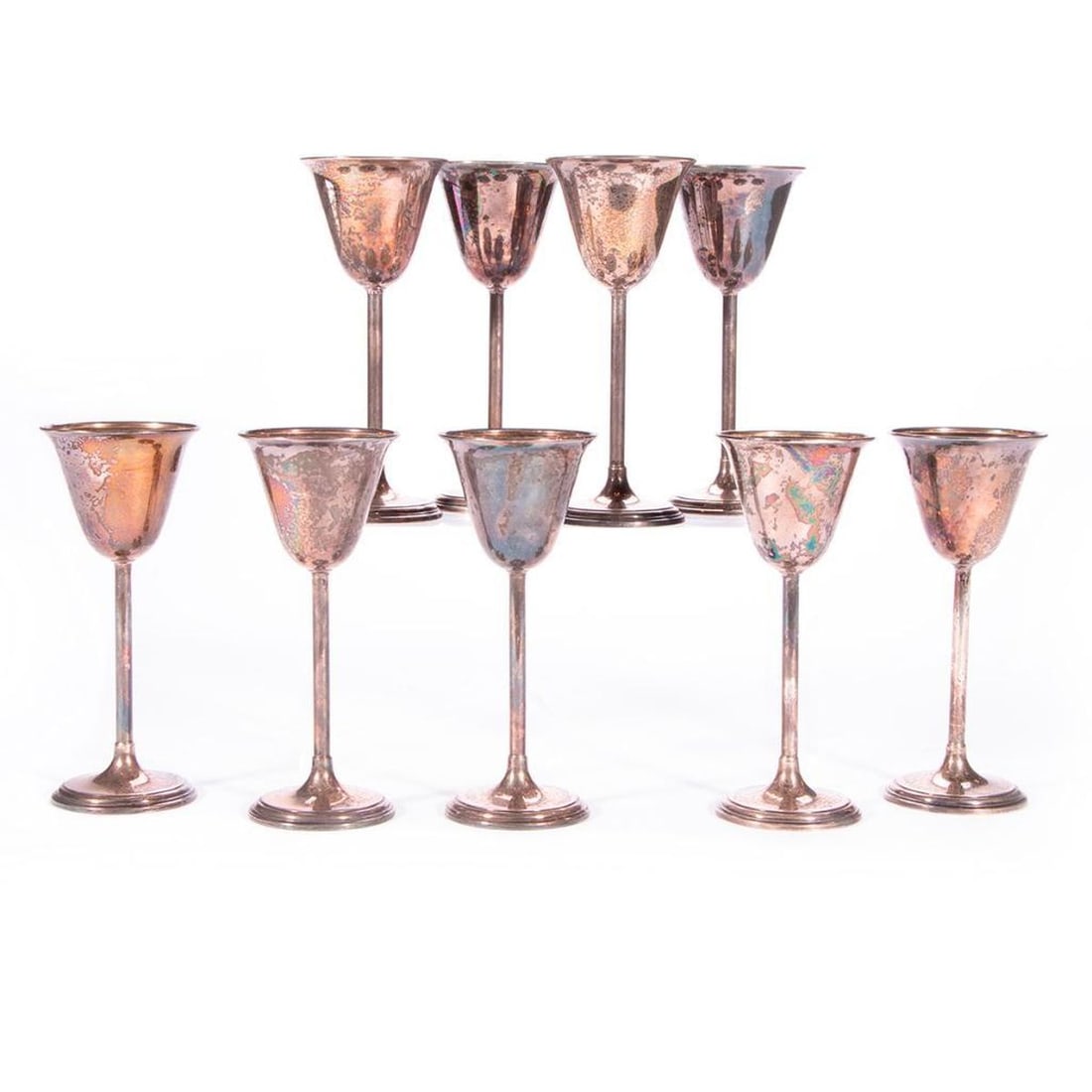 A set of nine sterling fluted drinking cups. (1 of 9)