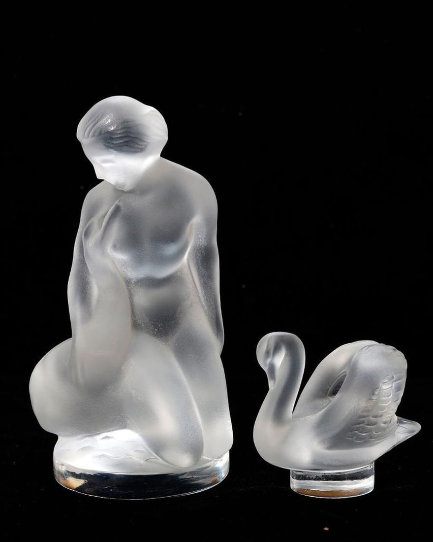 Lalique Crystal Leda and the Swan, with another: A crystal Leda and the Swan figurine (4 1/2" tall), and a small swan figurine(2" tall), both etchedLalique, France. Good condition.