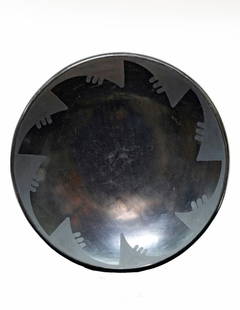San Ildefonso Blackware Plate, Maria Martinez: Smallblackware plate by Maria Martinez, signed "Marie." 6 1/2" diam. Condition: scuff marks to center.