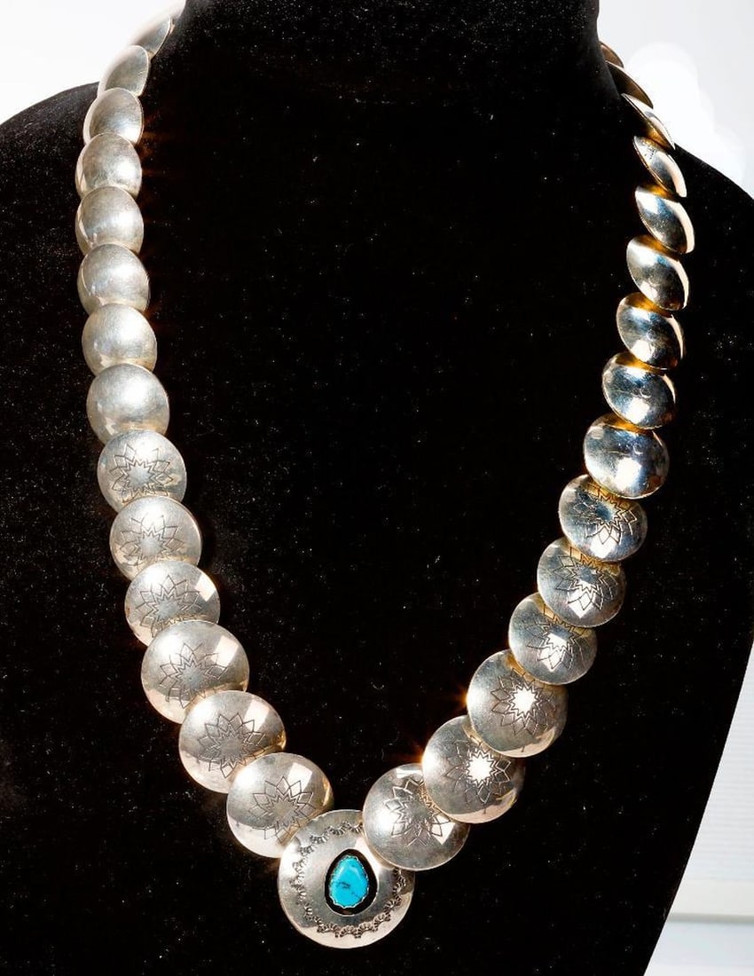 Lester Ortiz, A coral, turquoise and silver necklace: the Navaho necklace of reversible design, with engraved links; weighing approximately 120.4 grams; length 23 in.