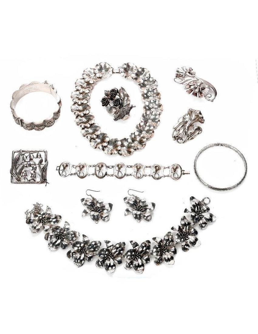 A group of silver jewelry: including Danecraft and Hobe, comprising a necklace and earring set, four brooches, three bracelets and a necklace; gross weight approximately 330 grams