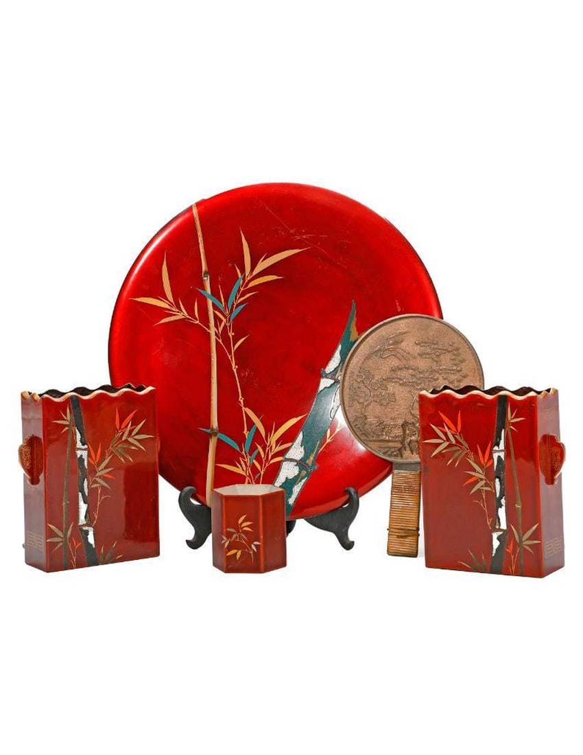 Japanese Enamel Decorative Objects, and a Kagami: A collection of four mid-20th century Japanese Maruni red enamel and bamboo motif objects, including a pen holder, a pair of rectangular vase/bookends, and a decorative platter (diam. 14"). Condition: