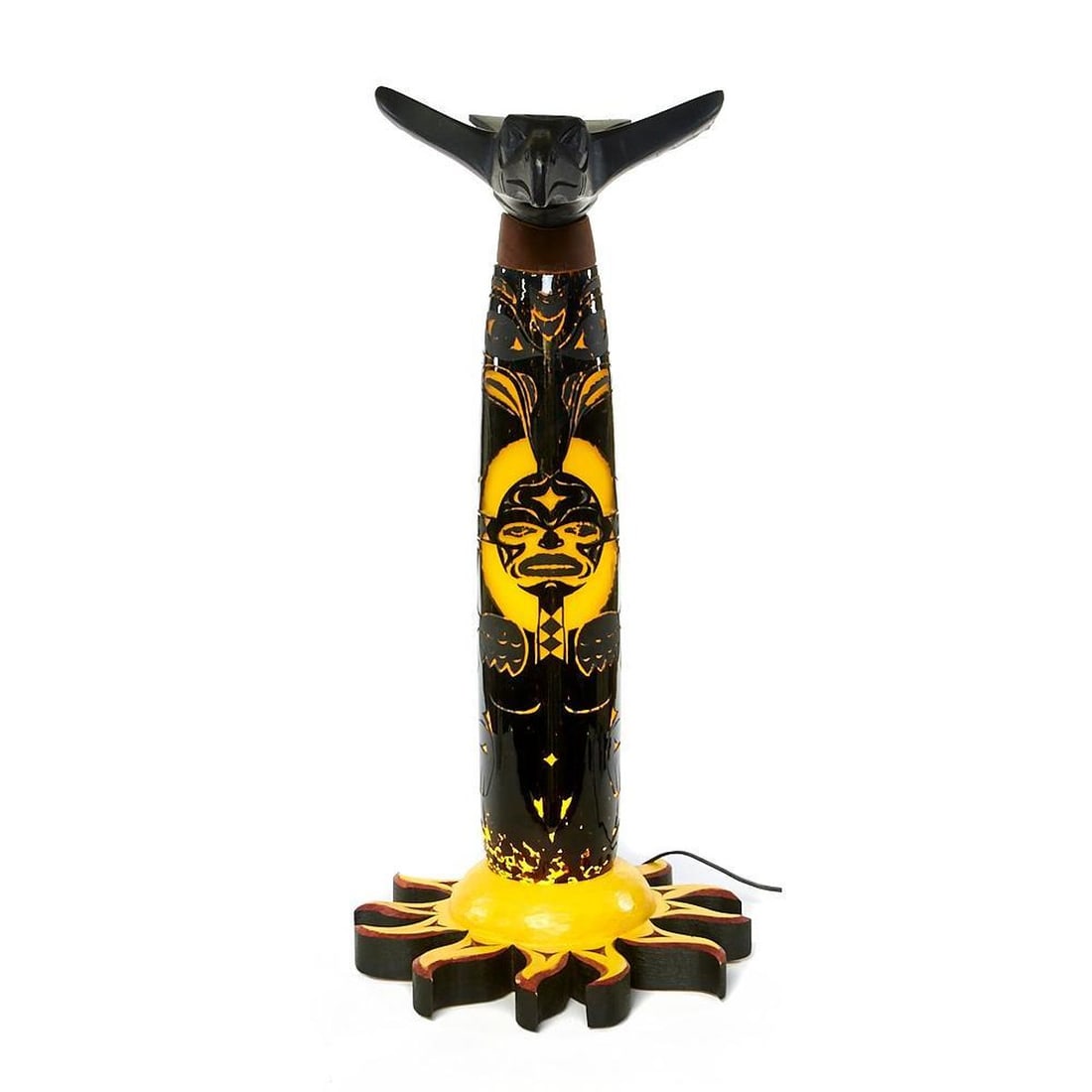 Northwest Coast Glass and Wood Lamp: The piece is conceived as a wood sun base, a hollow carved glass cylinder, and a wood raven finial; seemingly unsigned though a motif repeated on the rear top of the cylinder and under the raven's bea