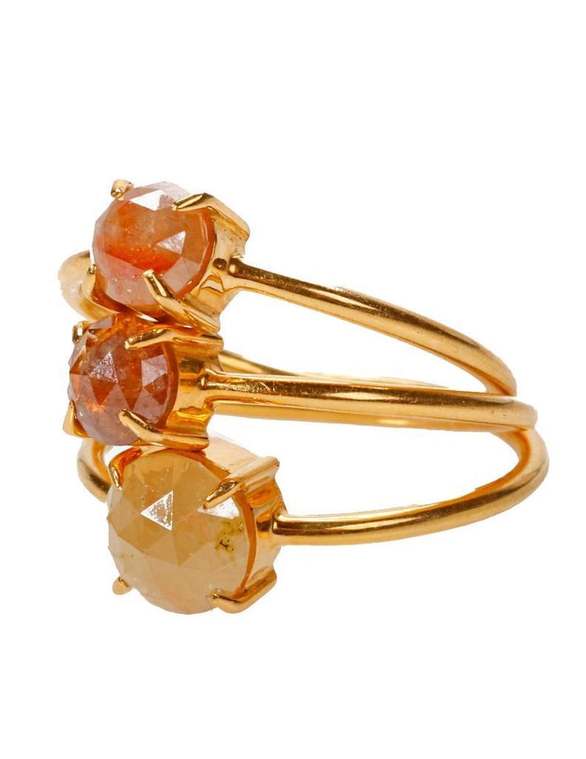 A set of diamond and 18k gold stackable rings: each set with a colored rose-cut diamond; estimated total diamond weight: 1.00 carat; 4.8 grams; sizes: 5 1/2 - 5 3/4