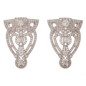 A pair of diamond and platinum clip brooches