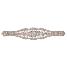 A diamond and platinum bar brooch