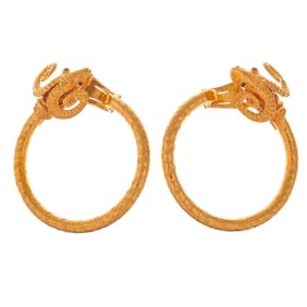 A pair of 18k gold ram's head hoop ear-clips