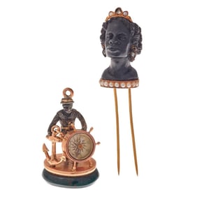 An antique blackamoor brooch and nautical bloodstone seal