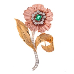 A diamond, emerald, platinum and gold brooch