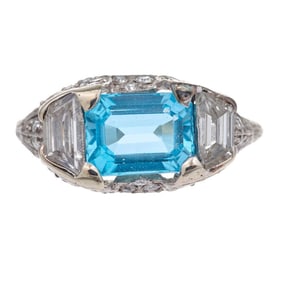 A blue topaz, diamond and platinum ring
