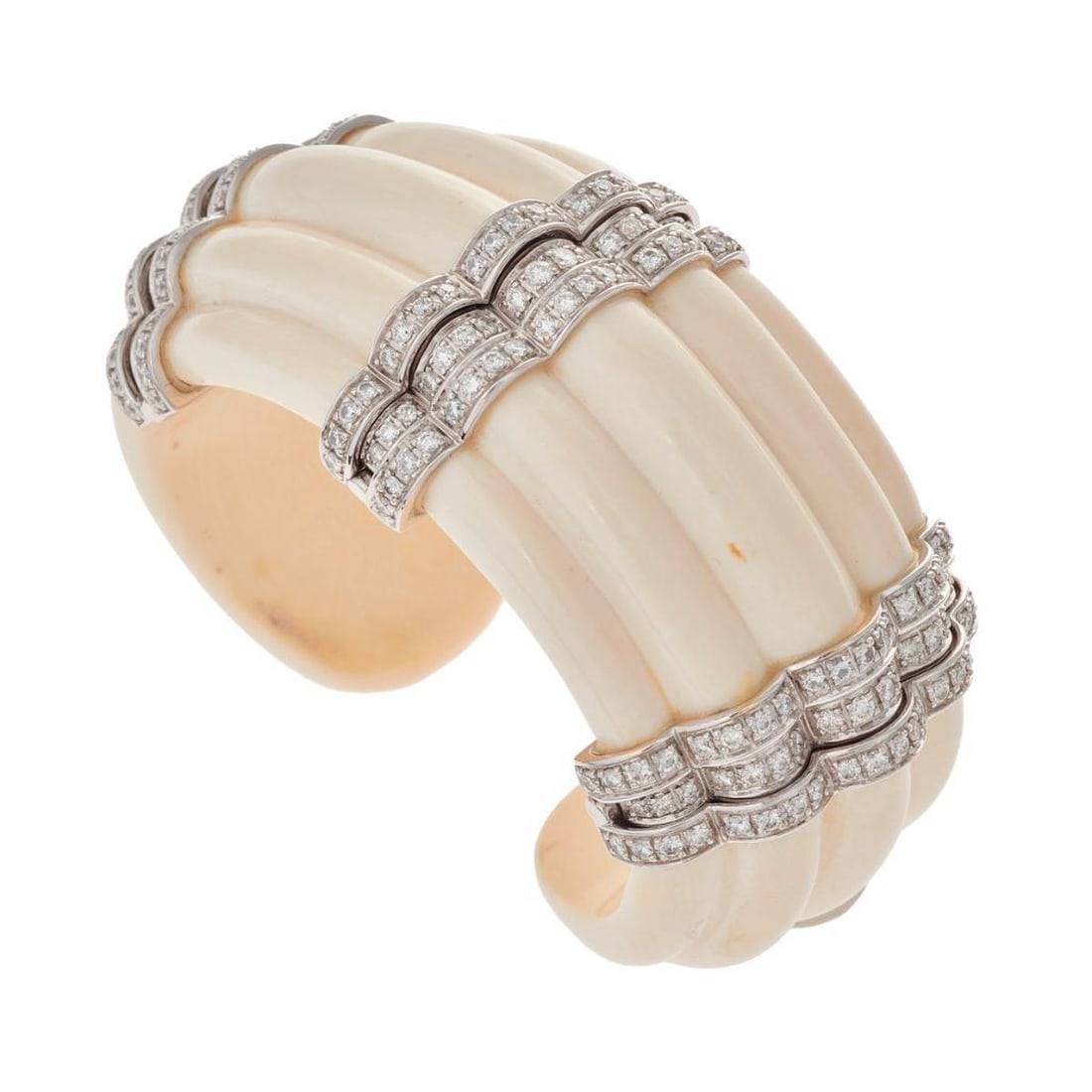 Seaman Schepps, A mammoth tusk & diamond cuff bracelet: the 18k white gold 'Rigate' hinged bangle bracelet, carved of mammoth tusk, and accented by numerous rounds brilliant-cut diamonds; total diamond weight: 2.86 carats; signed Seaman Schepps, ref. no. #