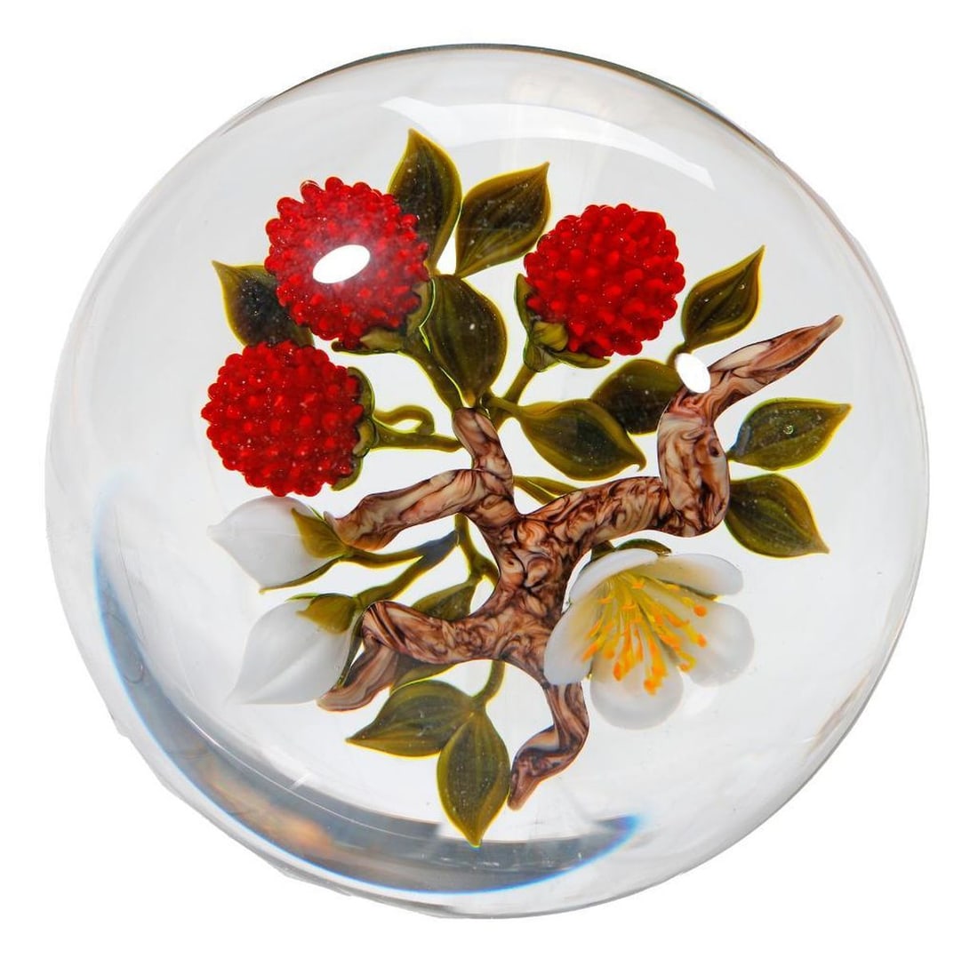 Victor Trabucco Mullberry Branch Paperweight, 1991: An art glass paperweight by Victor Trabucco (b. 1949), with flowering mulberry branch. Etched signature on side of dome, dated 1991. Approx. 3" x 3 1/2". Condition good, no chips/cracks.