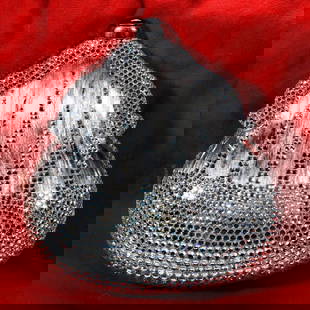 Judith Leiber Chatelaine Minaudiere Crystal Purse: The Judith Leiber silver-tone coin purse shape "Chatelaine" minaudiere, embellished with crystals and opening to a silver leather interior. Approx. 5 1/4" x 4 3/4". Includes the optional chain shoulde