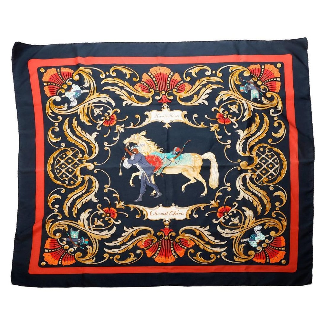 Hermes Silk Scarf, Cheval Turc: Hermes Paris silk scarf, "Cheval Turc" on navy ground, by Christiane Vauzelles. Edges hand-rolled to front. Approx. 35" square. Very Good vintage condition; very faint yellowing in the title cartouche