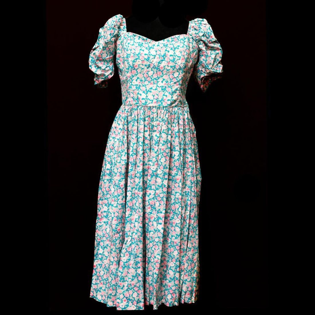 Laura Ashley Floral Puffed Sleeve Dress (Sz 12).: Circa 1980s. A Laura Ashley Made in Great Britain labeled pink and blue floral cotton puff sleeve midi dress with a sweetheart neckline, and gathered puff sleeves; the bodice with flexible "boning" an