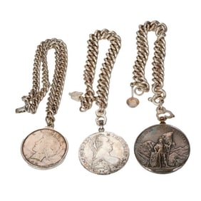 A group of silver bracelets