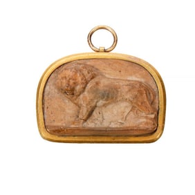 An ancient Roman ceramic and metal pendant