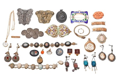A group of antique silver and metal jewelry