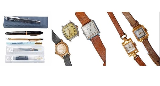 A group of watches and writing instruments