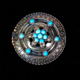 An antique turquoise and 14k gold brooch