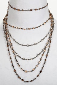 Three quartz and blackened silver station necklaces