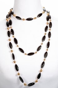 An antique 10k gold and beaded muff chain