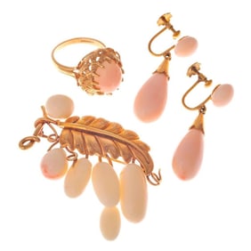 A group of angel skin coral and gold jewelry