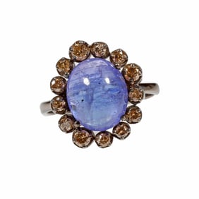 A tanzanite, diamond and silver ring