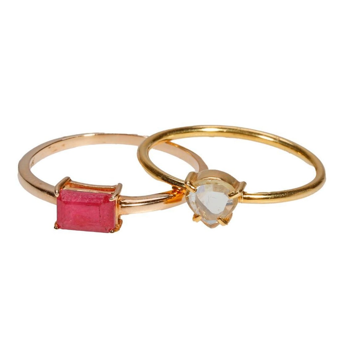 Two gem-set and gold stackable rings: one 18k gold ring with a pear-shaped table-cut diamond, together with a 14k gold ring featuring a rectangular-cut ruby; gross weight approximately 3.10 grams; sizes: 7 1/4 and 7 3/4