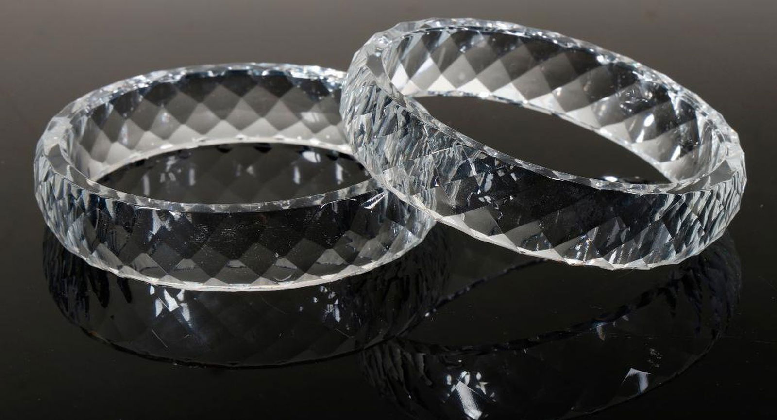 A pair of rock crystal bangle bracelets (1 of 2)