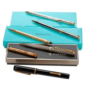 A group of pens and pencils