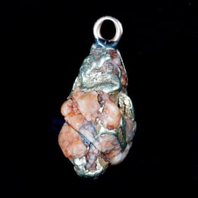 A gold-in-quartz nugget pendant