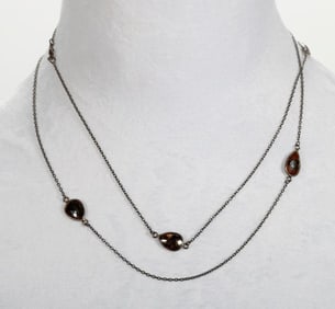 A black diamond and blackened silver station necklace
