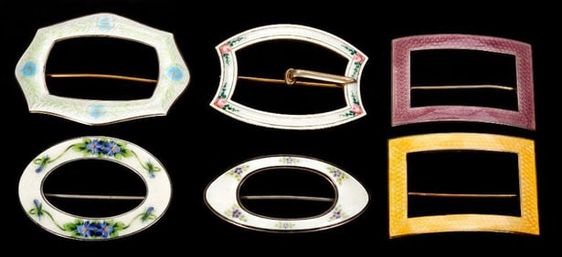 Six enamel and silver brooches and buckles