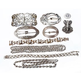 A group of antique silver jewelry