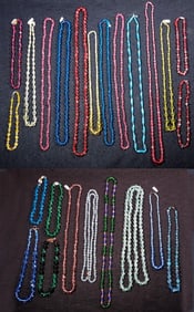 A group of crystal and glass necklaces