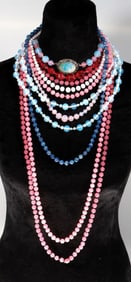 A group of beaded necklaces