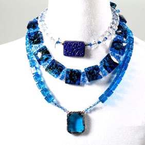 A group of beaded necklaces