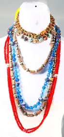 A group of beaded necklaces