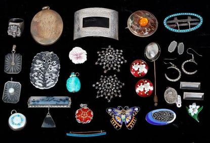 A group of antique silver jewelry