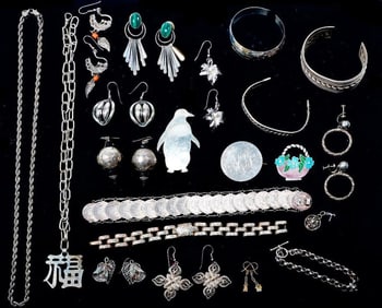 A group of silver jewelry