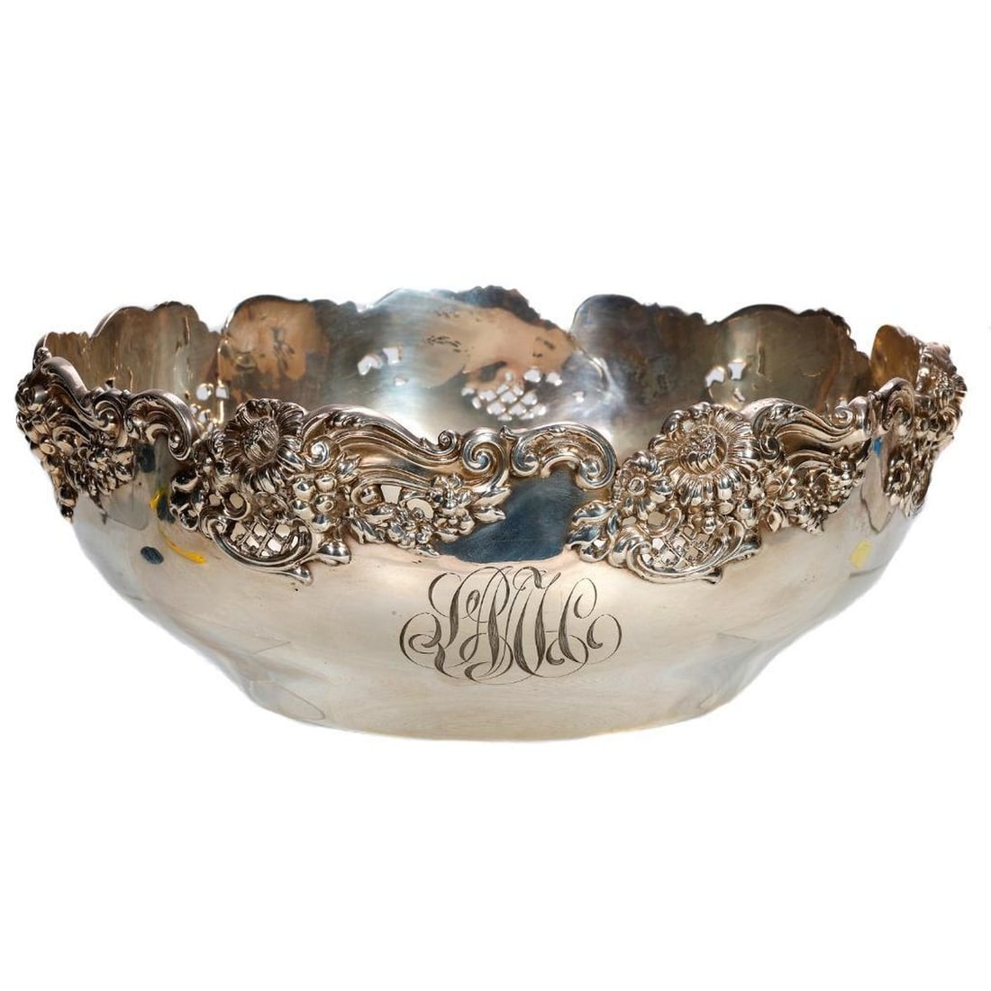 Black, Starr & Frost Sterling Bowl: The Black, Starr & Frost Sterling marked bowl with a pierced floral relief and scalloped rim; monogrammed M. Diam. 8 1/2". Approx. 399 grams.