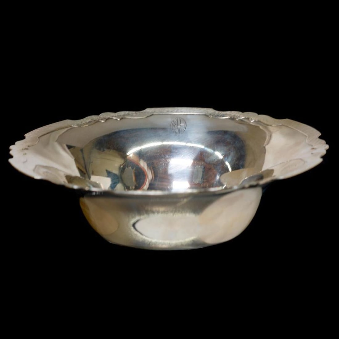 Shreve & Co. Sterling Bowl: The Shreve & Co. sterling marked bowl with a scalloped hammered band rim; monogrammed. Diam. 9 1/2". Approx. 382 grams.