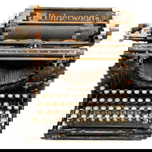 1920s Underwood Standard Typewriter: The Underwood Standard typewriter with ink ribbon reels installed; 9 1/2" x 12" x 12". Some surface rust; in need of cleaning/servicing.