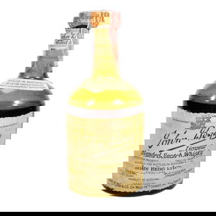 Vintage John Begg Blended Scotch Whisky: Boxed 4/5 quart bottle of 86.8 Proof Blended Scotch Whisky, Twelve Years Old, Blended and Bottled in Glasgow, Scotland by John Begg Ltd. Imported by The British-American Importation Company, Ltd., Los