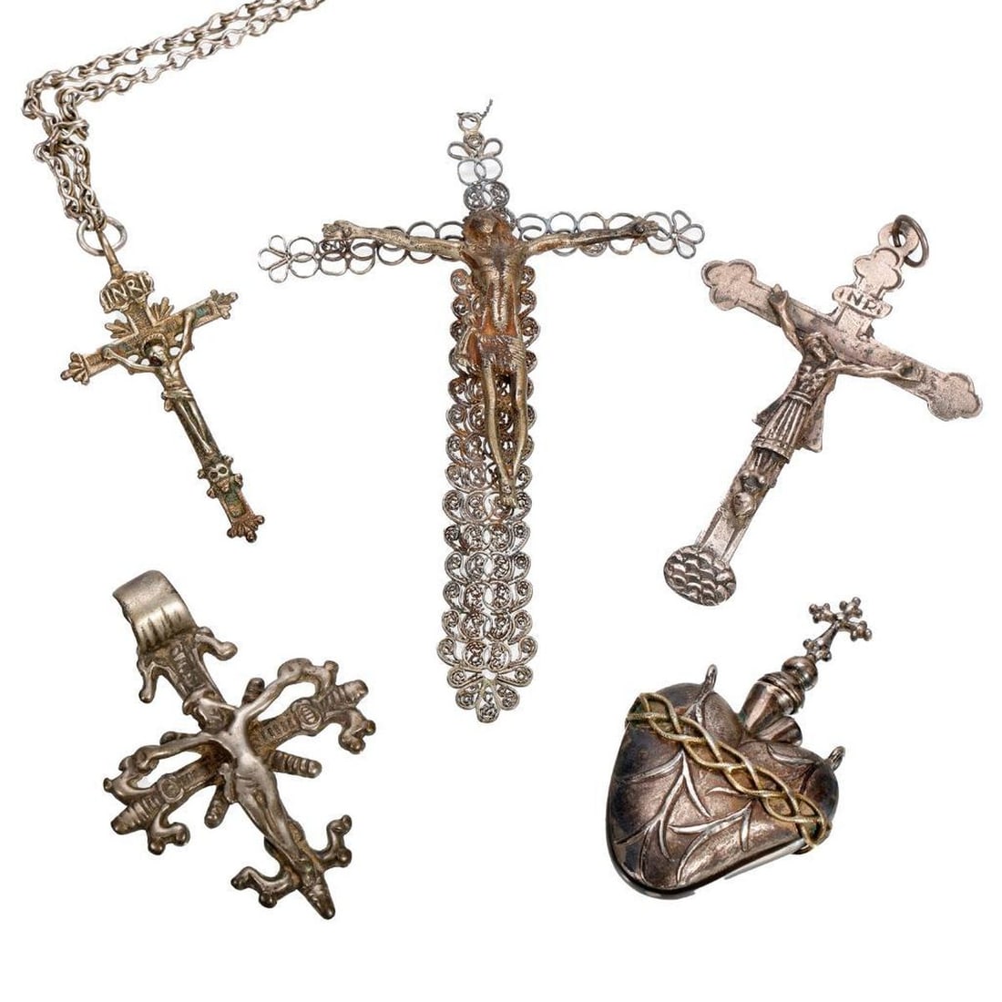 Sacred Heart Holy Water Flask and Four Crucifixes: A silver-plated/gilt metal (unmarked) Holy Water/Oil flask in the form of the Sacred Heart (3" long); together with a collection of silver metal (unmarked) crucifixes, ranging from 2 1/2" to 5 1/2".