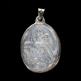 A 14k gold, silver St. Agnes wearable medal-pendant