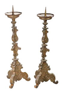 Pair of Baroque Style Altar Prickets: A pair of repousse gilt-brass/metal altar prickets, 26" tall. Condition: each with some denting/wear, small holes/dings. 26" high.